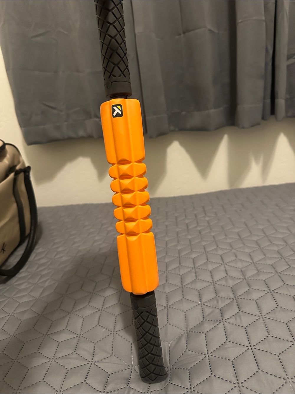Orange Foam Roller Stick with Black Handles